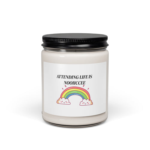 Nine-ounce soy candle in a clear glass jar with a black lid, white sage and lavender scent, labelled with a rainbow arching over clouds and the words “Attending life is nooiiccee”.