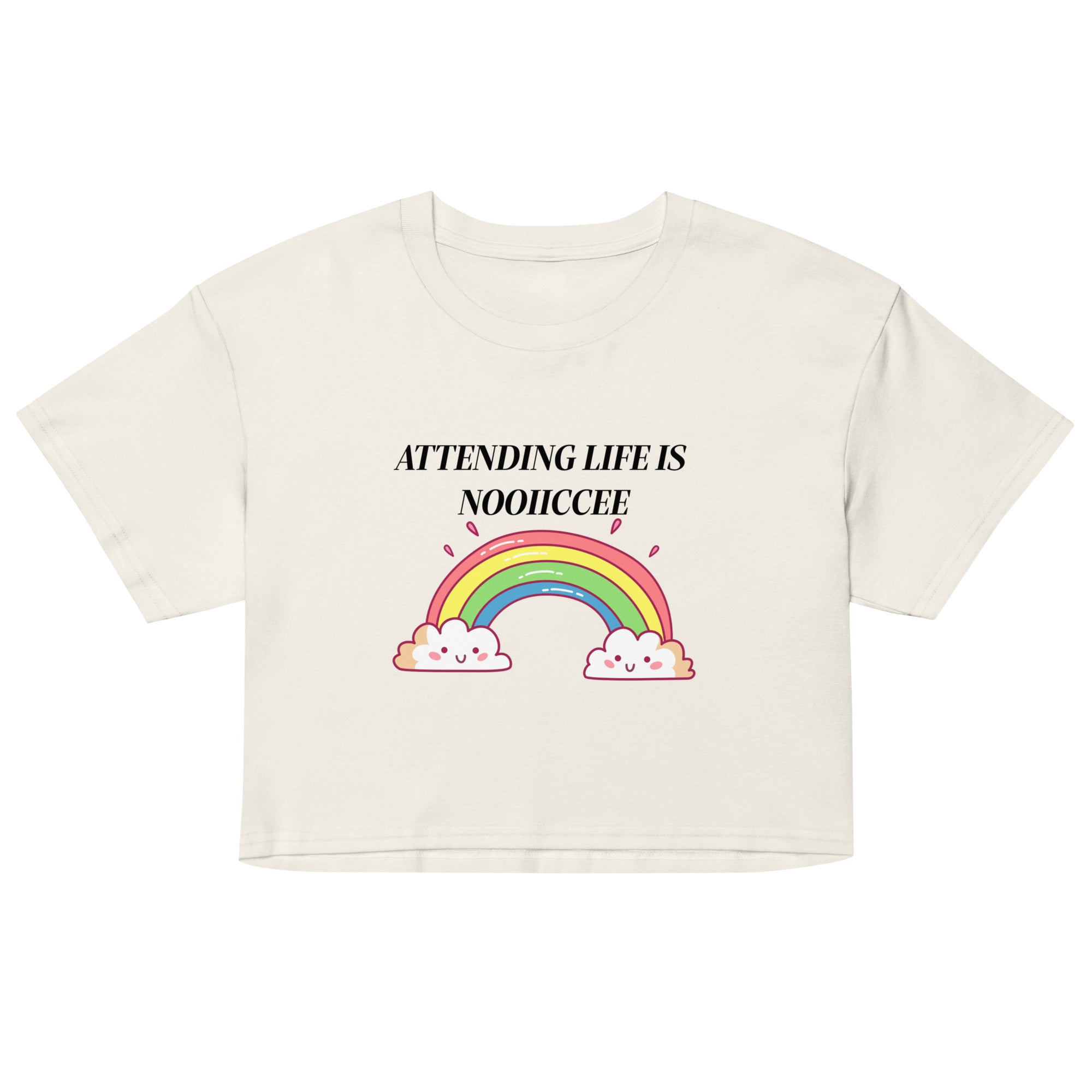Ecru women’s cropped t-shirt with the Attending life is nooiiccee rainbow design, front view.